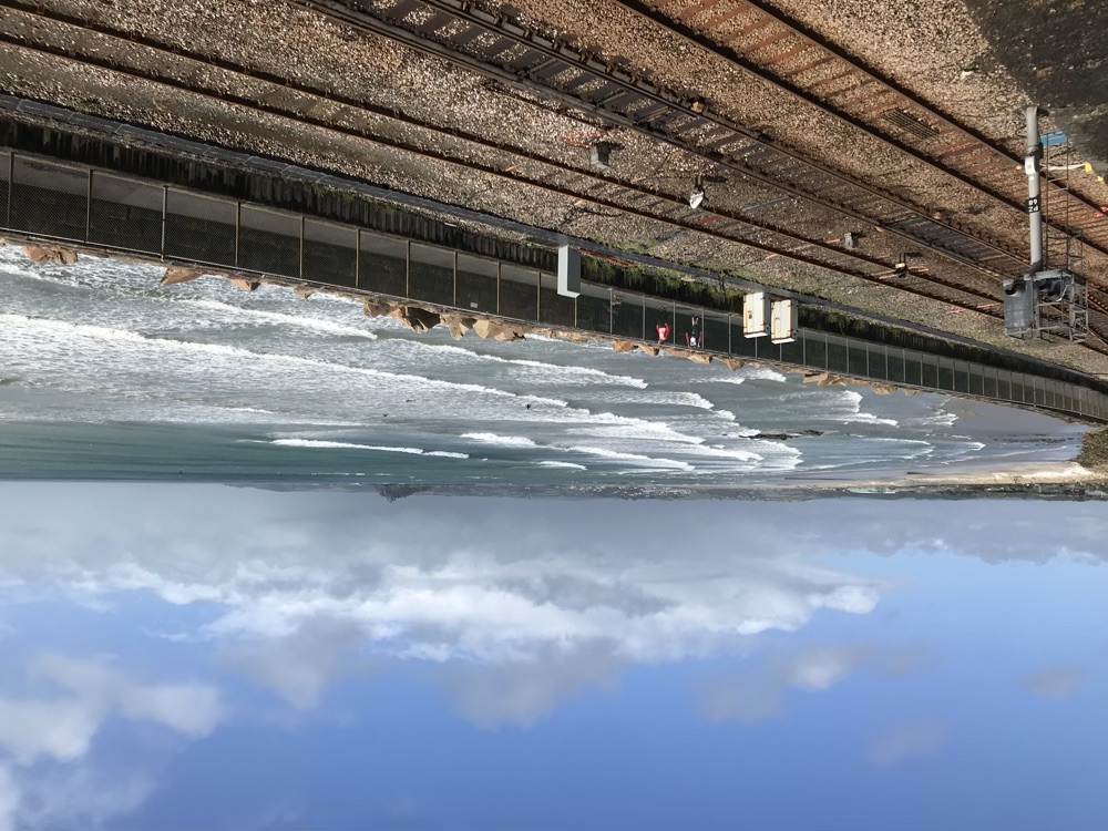 View of the train line, and the blue sea on a sunny day.